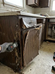 Damaged kitchen cabinets that require replacement