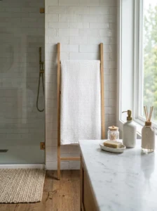Textured white bathroom with woven towels and handmade tiles