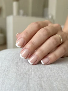 Short rounded-square nails with classic white French tips