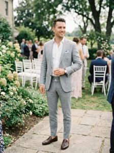 Alt Text: Man wearing a lightweight open-collar suit for a smart casual wedding