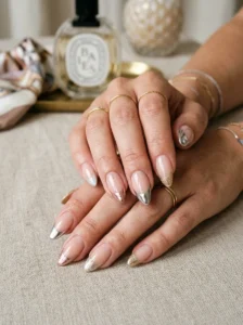 Metallic and glitter French tip variations on almond-shaped nails