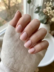 Applying a protective top coat to help a spring manicure last longer.