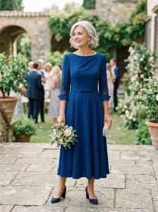 Alt Text: Textured crepe gown for understated mother of the bride elegance