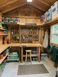 Labeled shed bins and shelves with marked floor zones and an inventory list for easy organization.