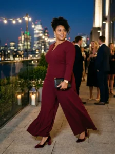 Alt Text: Plus-size woman wearing a statement belt over a simple black dress.