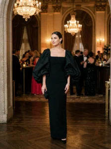 Alt Text: Black gown styled with elegant statement accessories