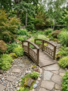 Alt Text: Small garden bridge crossing a river rock dry creek bed.